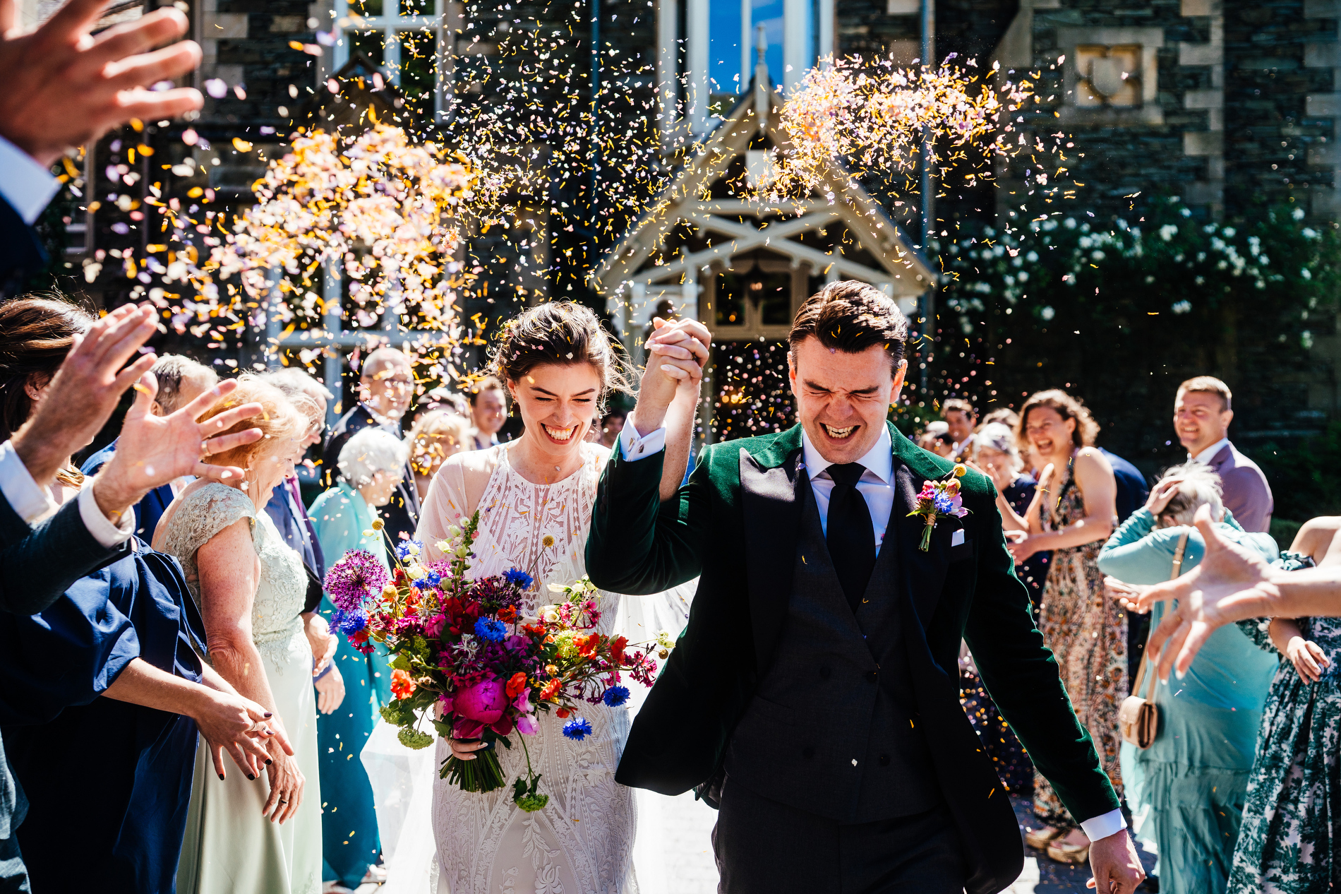 the confetti moment at a wedding at the forest side