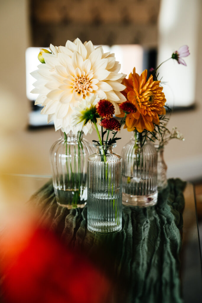 autumnal wedding flowers in bud vases